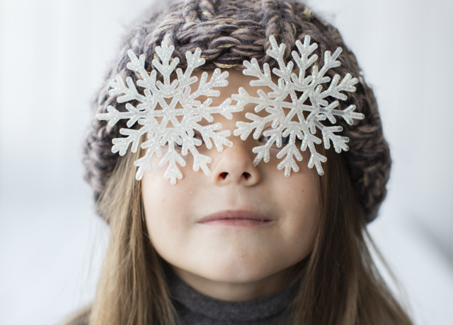 Funny Little Girl With Snowflakes As Eyes