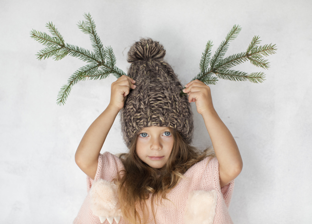 Funny Little Girl Posing With Winter Hat