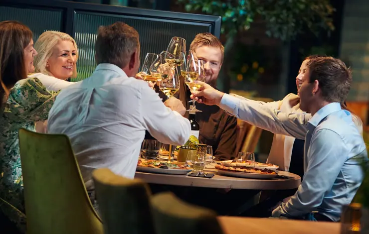 People enjoy themselves and toast at the Casa Montagna restaurant on Beitostølen