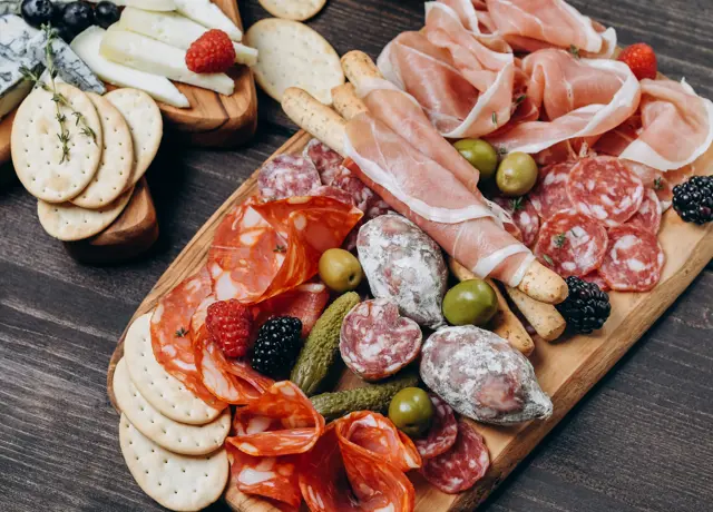 Cured food prepared on a cutting board